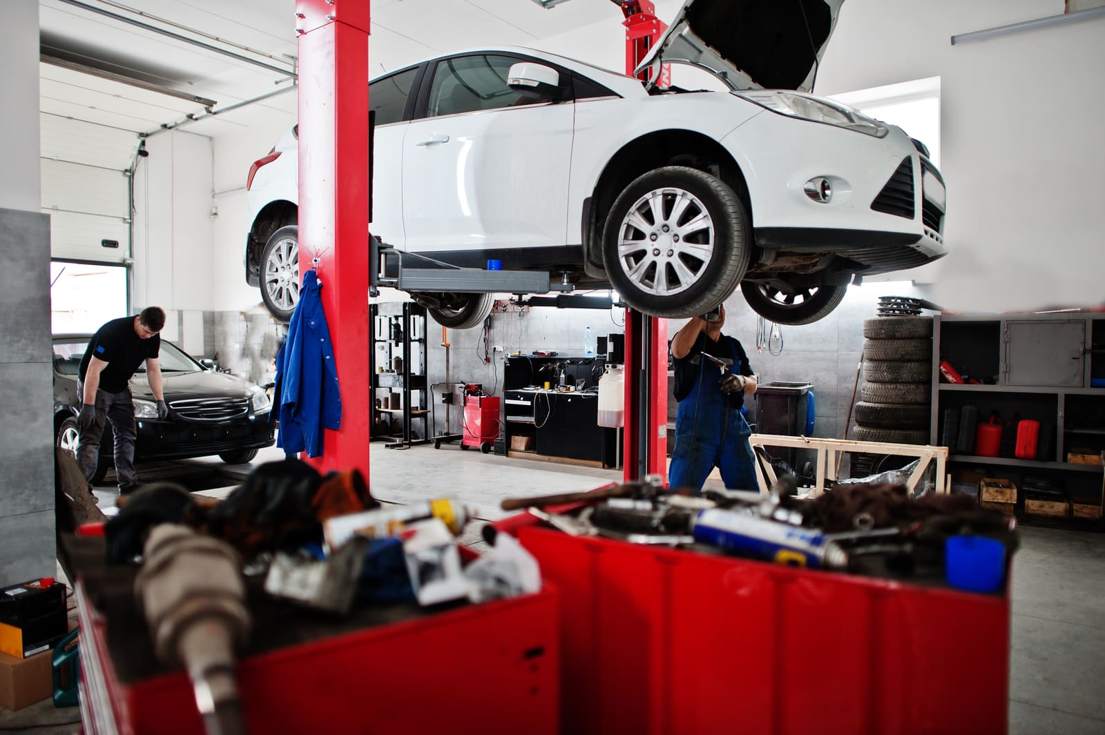 A car on the lift mid-repair in the Parkside Auto Care shop